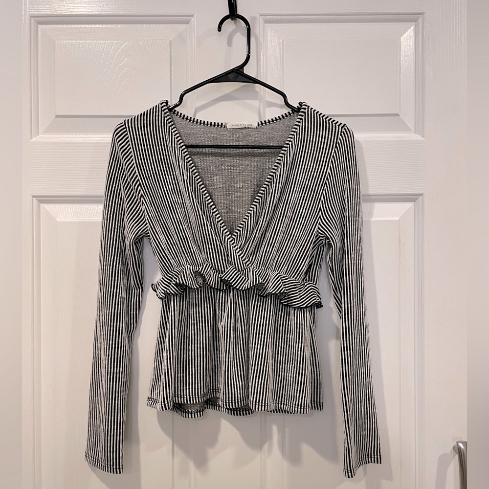 Caution to The Wind Peplum Top Long Sleeve